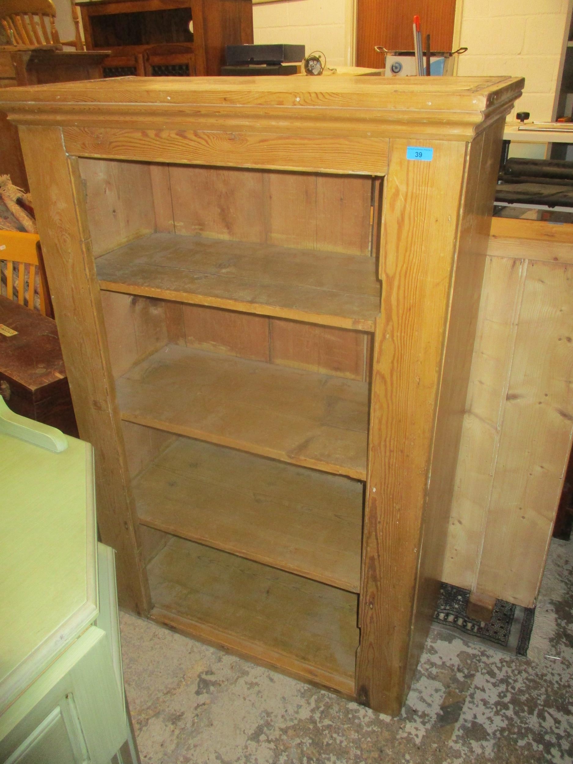 A Victorian pine cabinet with internal shelves 139cm x 90.5cm x 43cm A/F (doors missing) Location: