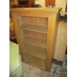 A Victorian pine cabinet with internal shelves 139cm x 90.5cm x 43cm A/F (doors missing) Location: