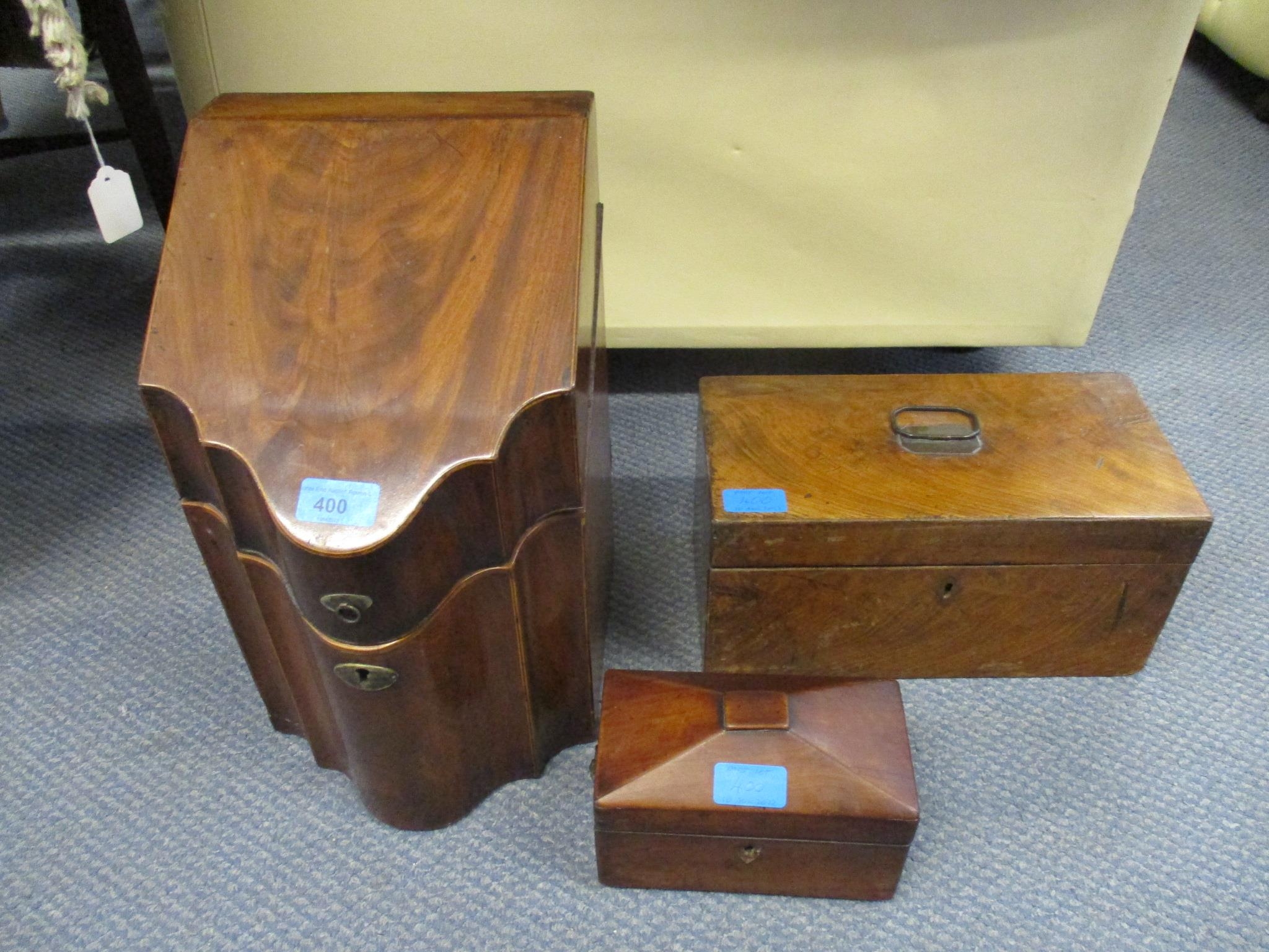 A Georgian mahogany serpentine fronted knife box, later converted interior to a stationery box, a