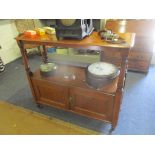 A Victorian walnut two tier buffet stand with turned supports, cupboard doors below and on