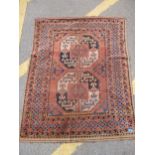 An early 20th century hand woven small Middle Eastern rug, two central octagonal medallions with
