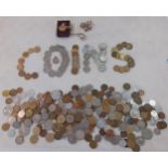 A quantity of foreign coins, two bank notes and a vintage gold tone brooch with white paste stones