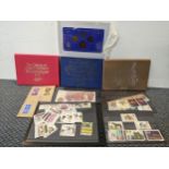 Four cased sets of coins to include three Proof Royal Mint sets together with mixed stamps Location:
