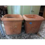 A pair of terracotta garden planters decorated with Prince of Wales feathers Location:G