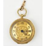 A Victorian 18ct gold open faced fob watch having a gilt dial with floral engraved centre and Arabic