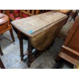 A 1930's oak gateleg table on bobbin turned supports, 75cm h x 91cm w Location: