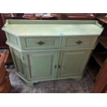 A modern green painted side cabinet having two drawers above two cupboard doors, 101cm h x 43cm w