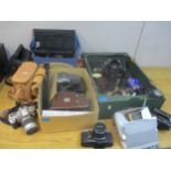 A selection of film and digital cameras, lens, camera bags and accessories to include a Canon E05