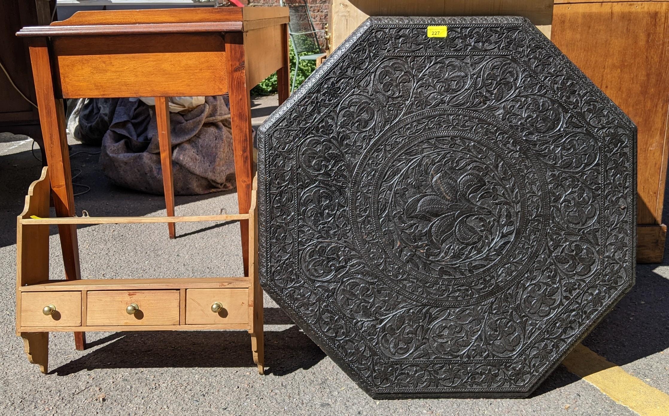 A late 19th/early 20th century Indian carved table top with a pine spice rack Location: