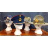 Four Worldwide police hats comprising a Tasmanian police fur felt hat made by Mountcastle PTY,