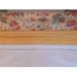 Three bolts of fabric comprising a large bolt of late 20th Century floral chintz, a bolt of yellow