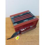 A vintage Quad accordion in red and black, 20cm x 28cm. Location:1:1 Condition: Handle A/F and