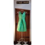 Elsa Schiaparelli-A 1960's lime green, silk mix, sleeveless and short length dress with deep pockets