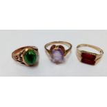 A 14ct gold and green stone ring, 3.45g, UK ring size J and a 9ct gold and 2 rectangular red