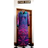 Four 1970's ladies full length polyester dresses comprising an Elmor of London pink psychedelic