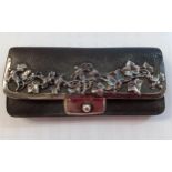 A Victorian black leather purse with silver vine decoration and silver clasp. Location:RAB