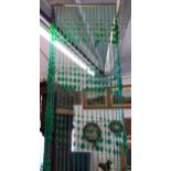 A vintage green plastic bead door curtain 200cm L x 70cm w Location: Ram/beams