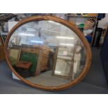 A 19th century large oval wall hanging mirror having gadrooned moulding to the frame, 137cm x