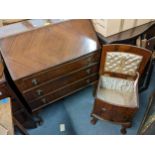 A mid 20th century mahogany bureau together with a walnut sewing cabinet, drum table and an