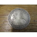 A silver Mexico Spanish Colonial 8-reales Carolus IIII Del Gratia coin dated 1807, good to fine
