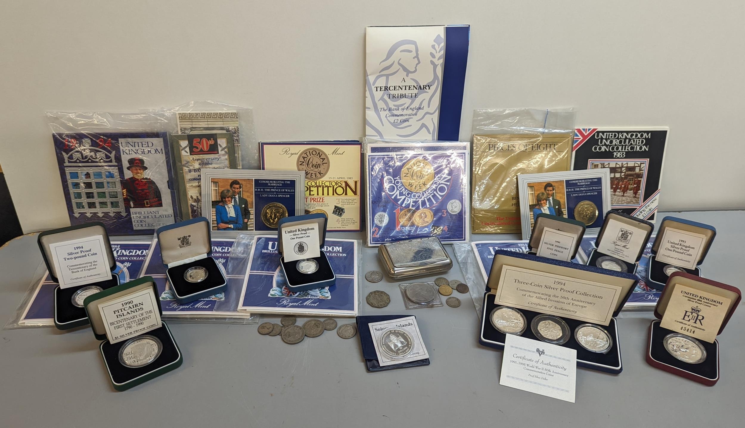 A collection of silver proof coins and sets to include 1991-1995 WWII 50th anniversary set in