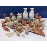 A quantity of Japanese carved soapstone ornaments to include a pair of grey vases A/F on