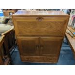 A mid 20th century retro Ercol Windsor bureau/drinks cabinet model 469 109cm h x 82.5cm w Location: