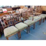 A set of five walnut dining chairs with green upholstered seats and a matching carver chair A1F