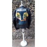 A black leather jacket with hand painted Metallica image to the rear, dated and hand painted '