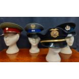 Four Worldwide police hats comprising a Polish cap, size 54, a Slovak Republic cap made by Kras