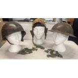 A WWII era Russian steel infantry helmet with liner, a British 'Brodie' style steel helmet shell and