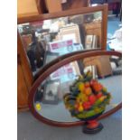 Two mid 20th century wall mirrors, a decorative painted wooden plaque in the form of a bowl of fruit