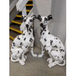 A pair of large painted resin statues of seated Dalmatian dogs 90cm h Location: Foyer