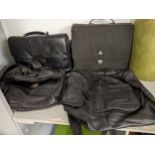 Four black holdalls to include leather examples Location: