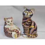 Two Royal Crown Derby paperweights in the form of cats, having gold stoppers Location: