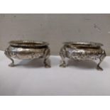 A pair of Victorian silver salts raised on three hoof shaped feet 123.5g