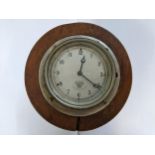 An early 20th century Smiths chrome car clock mounted in a treen case with hinged opening Location: