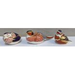 Three Royal Crown Derby paperweights to include one in the form of a pheasant, gold stoppers