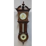 A Victorian mahogany clock fitted with a German movement with barometer and thermometer below,