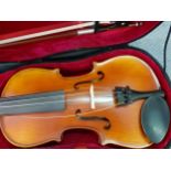 An Intermusic student's violin and bow in fitted case Location: RAM