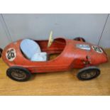 A mid 20th century Triang painted metal child's pedal car, with spoked wheel Location:G