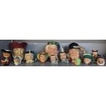 A collection of 13 Royal Doulton and other character jugs in various sizes to include Bacchus,