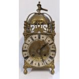 Circa 1900 a 17th century style lantern clock with a bell top surrounded by pierced panels, fitted