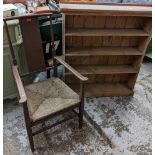 An Arts & Crafts oak armchair, together with a pine open bookcase Location: