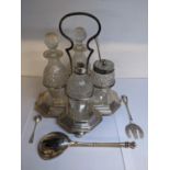 A silver plated cruet set together with a Russian white metal and Niello decorated spoon decorated