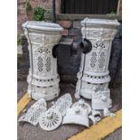 A pair of mid 20th century white painted decorative stoves, 76cm h x 34cm w Location: