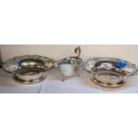 A pair of silver plated wine coasters together with a silver plated sauce boat Location: