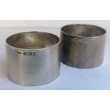 A pair of mid 20th century engine turn silver napkin rings, with H monograms, 104.5g Location: