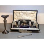 Mixed silver to include a cased set of, weighted, silver ink pot and pair of candlesticks, a