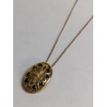 A 9ct gold pendant inset with eight Sapphires and on a 9ct gold necklace, 3.8g Location: